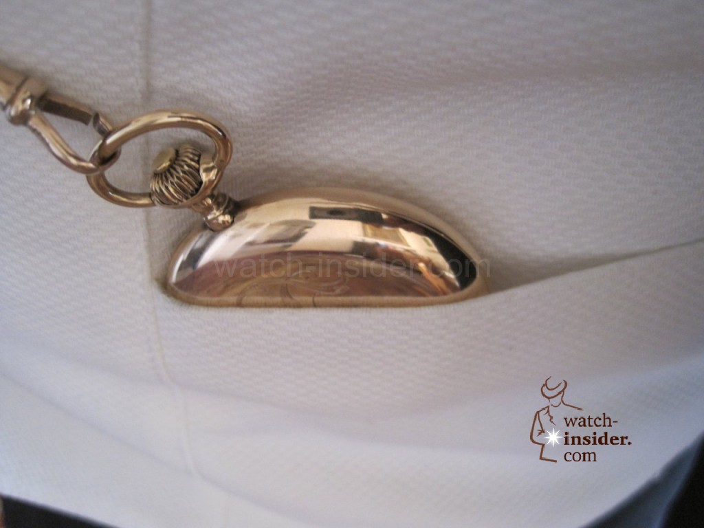 Pocket replica watch with its key chain is attached to the white vest of the tailcoat. Picture found @ uhrforum.de